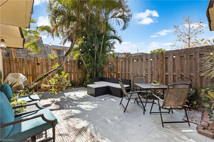 Spacious westerly facing courtyard with mature Pemba palm