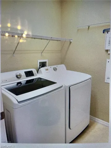 Laundry room featuring separate washer and dryer