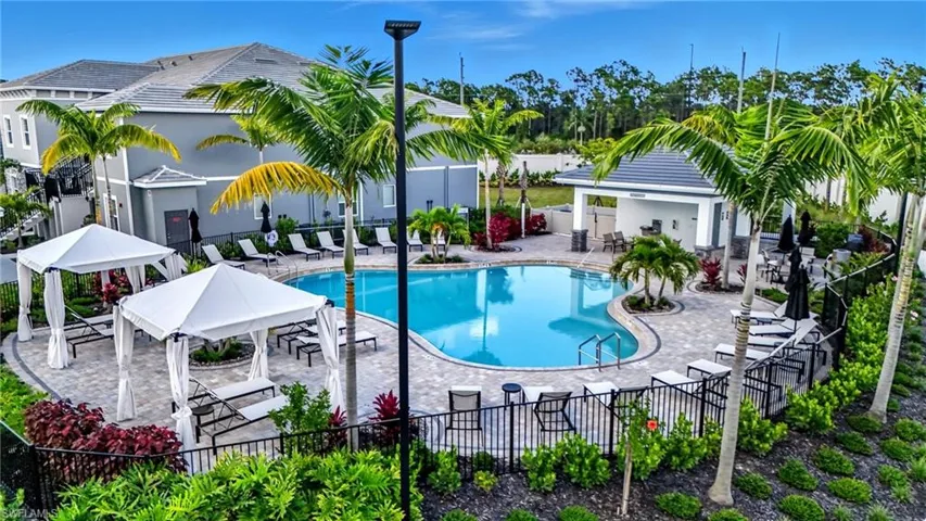 Community pool with a patio area and a gazebo
