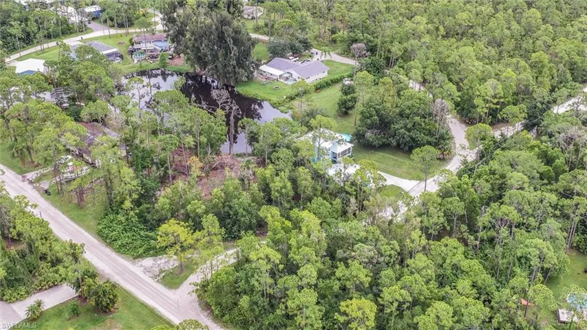 Aerial overview of property's location featuring a forest