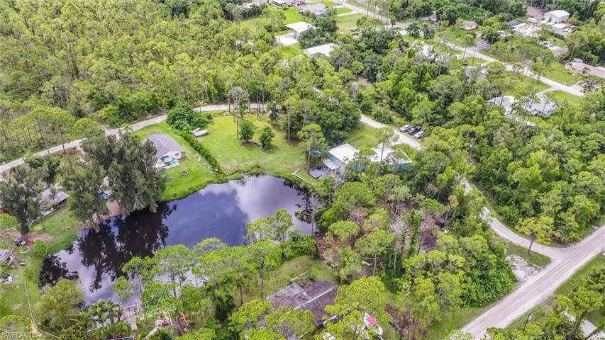 Aerial overview of property's location with a nearby body of water