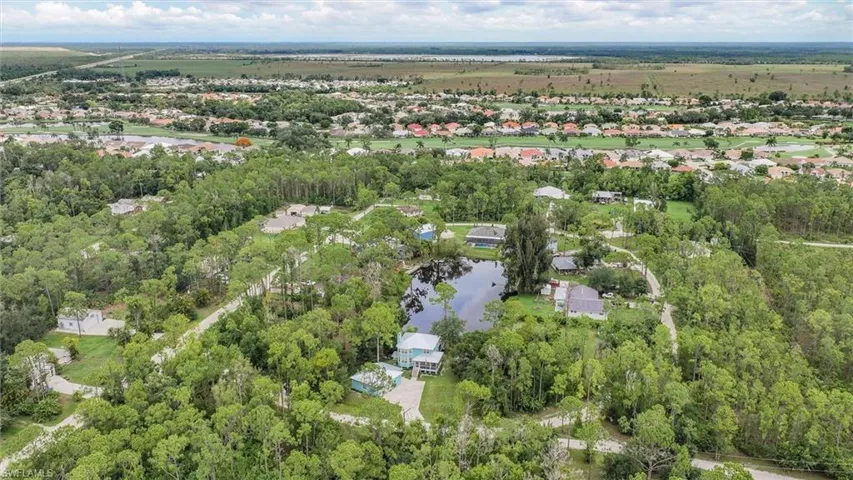Aerial view of property's location featuring a large body of water