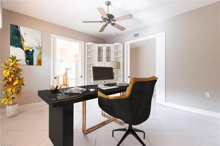 Office area featuring a ceiling fan and light tile patterned floors