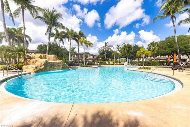 Community pool with a patio area