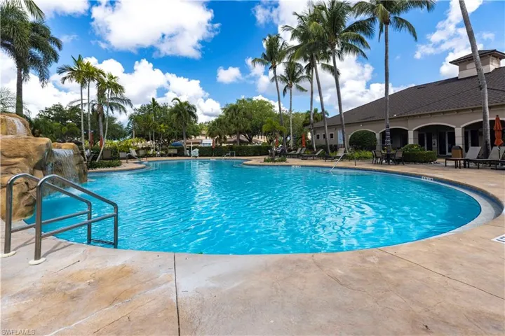 Community pool featuring a patio