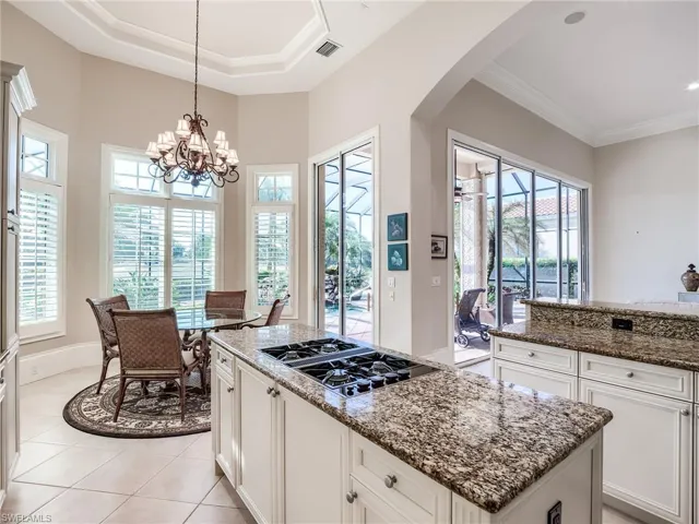 Kitchen featuring white cabinets, plenty of natural light, and stainless steel gas stovetop