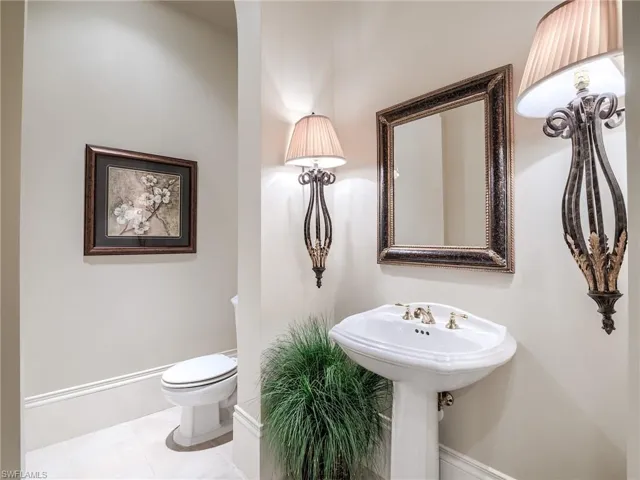 Bathroom with tile flooring and toilet