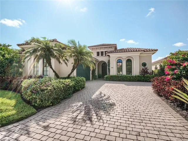 Mediterranean / spanish-style house with a garage