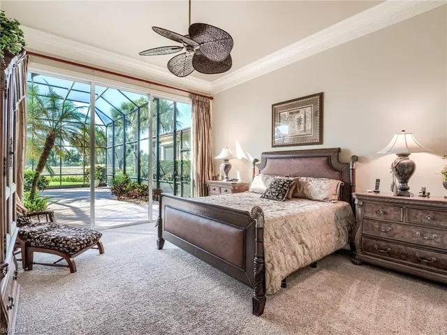 Carpeted bedroom featuring access to outside, ornamental molding, and ceiling fan