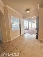 Large French Style Entry Doors Direct Access to Courtyard and Spacious Foyer