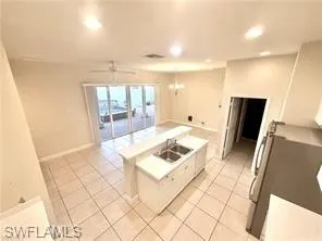 Large Kitchen with Eat in Area Large Island with Sink, 4 sliders to Courtyard, Coffee Bar Stainless Appliance with Abundant Tall Kitchen Cabinets