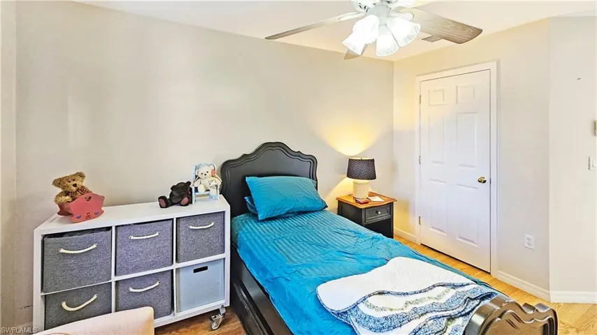 Bedroom with wood-type flooring and ceiling fan