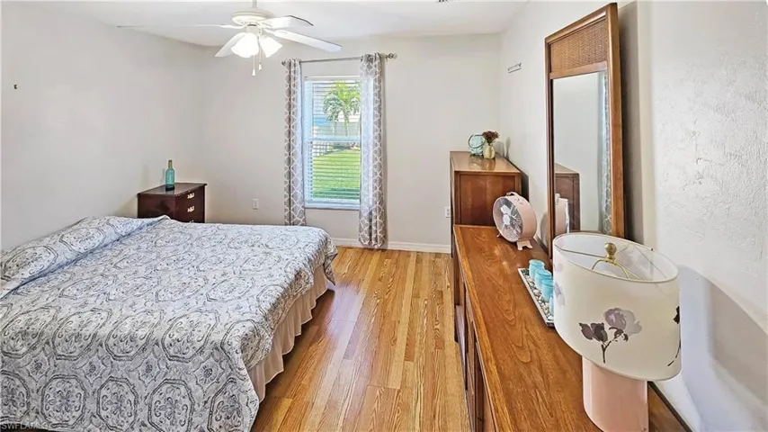 Bedroom featuring ceiling fan and light wood-type flooring
