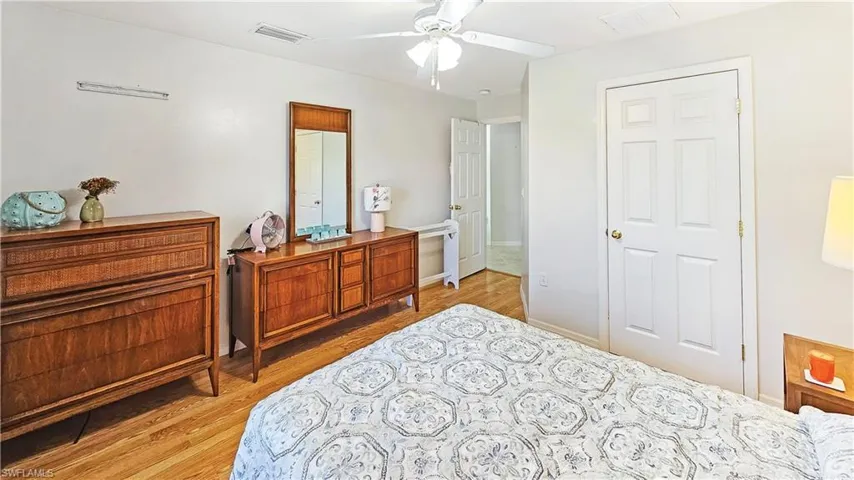 Bedroom featuring ceiling fan and light hardwood / wood-style flooring