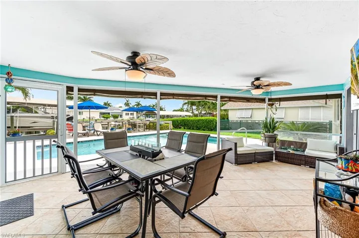 View of patio featuring ceiling fan and an outdoor hangout area