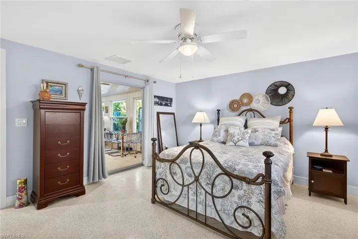 Primary Bedroom with ceiling fan and access to exterior