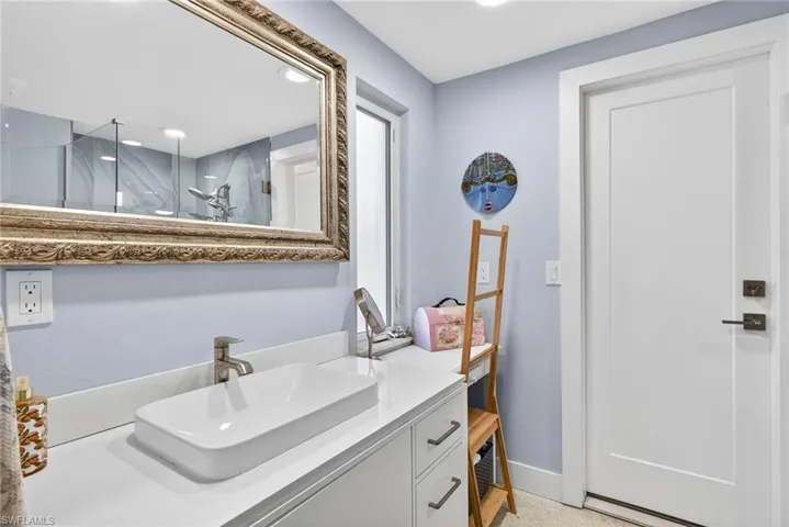 Primary Bathroom with vanity, a shower stall, and recessed lighting