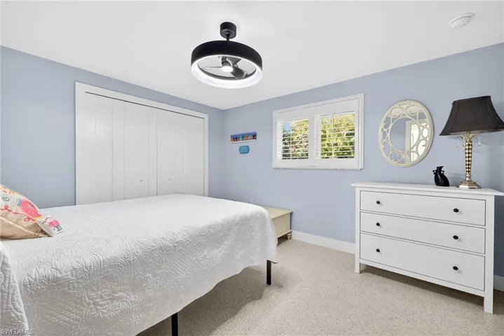 Bedroom with a closet and ceiling fan