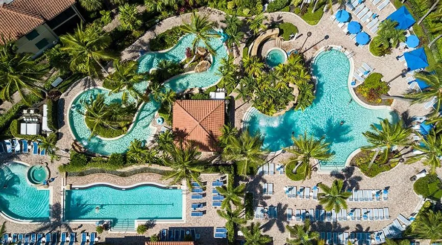Naples Bay Club pools including a lazy river, waterfall, and adult section