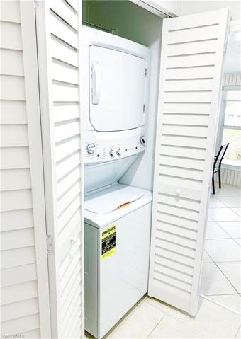 New Stackable Washer/Dryer set in closet off the kitchen