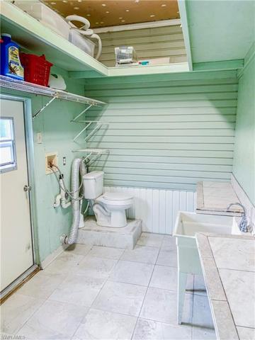 Large storage shed off pool area and carport with extra bathroom area