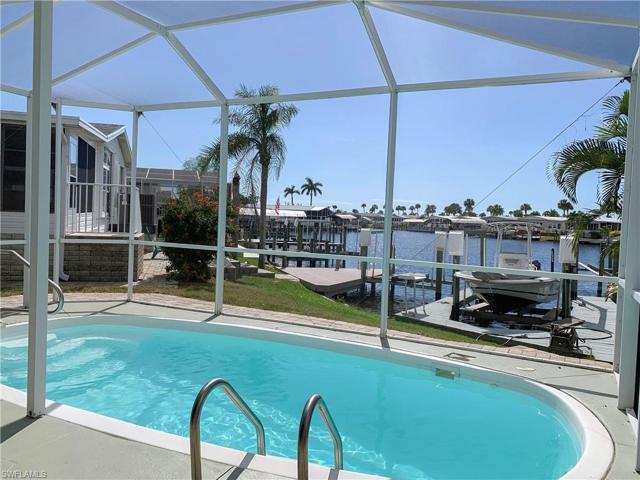 Beautiful pool with views of the dock, lift and big water canal