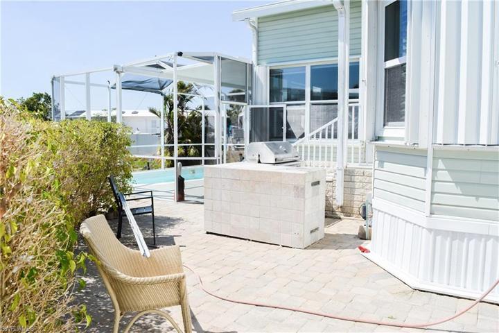 Rear outdoor kitchen off pool and shed area