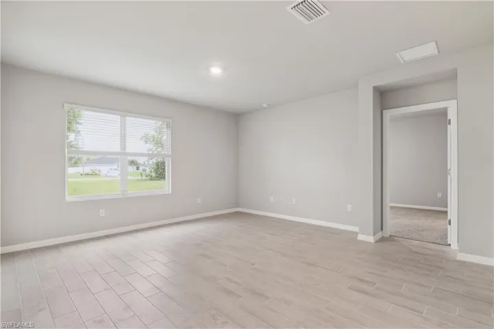 Empty room featuring light hardwood / wood-style flooring