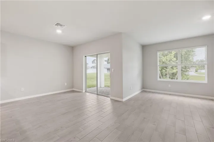 Unfurnished room with light hardwood / wood-style floors