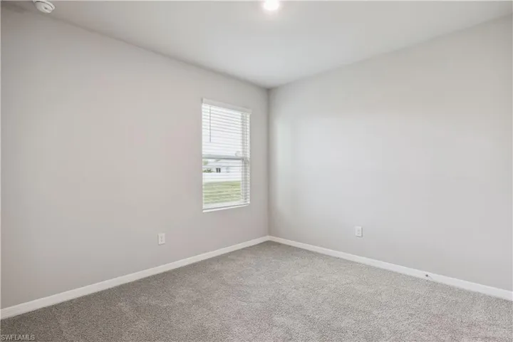 Empty room with carpet floors