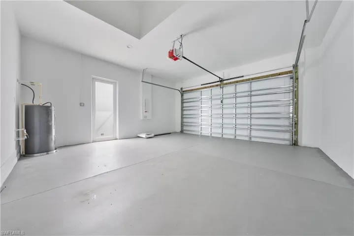 Garage featuring water heater