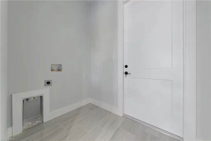 Laundry room featuring hookup for an electric dryer and hookup for a washing machine