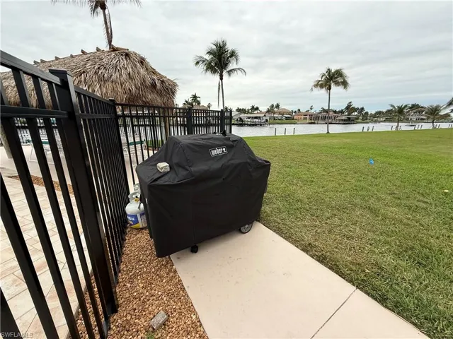 View of yard featuring a patio and a water view