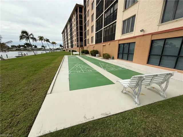 View of community featuring shuffleboard