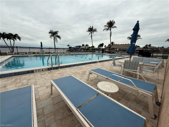 Community pool featuring a patio