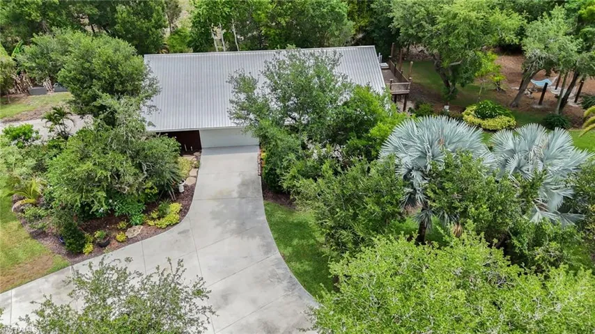Overhead view of residential home with 3-car garage.