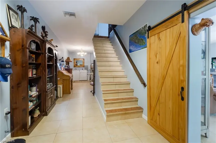 Laundry, Office, Mudroom, multipurpose, stairs leading upstairs to primary and guest room.