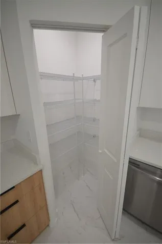 Unfurnished bedroom featuring visible vents, marble finish floor, and baseboards