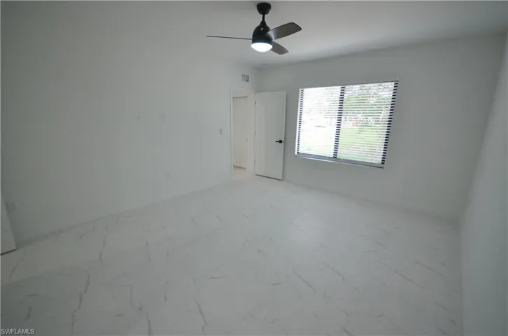 Clothes washing area with baseboards, laundry area, electric dryer hookup, washer hookup, and marble finish floor