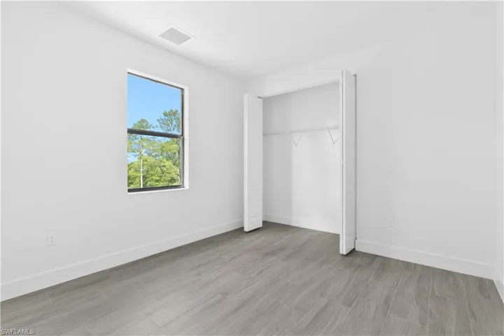 Unfurnished bedroom with light wood-style floors