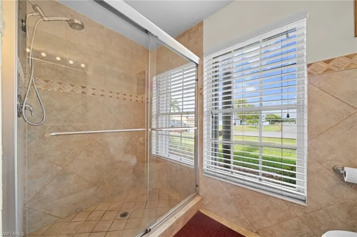 Full bathroom featuring a stall shower