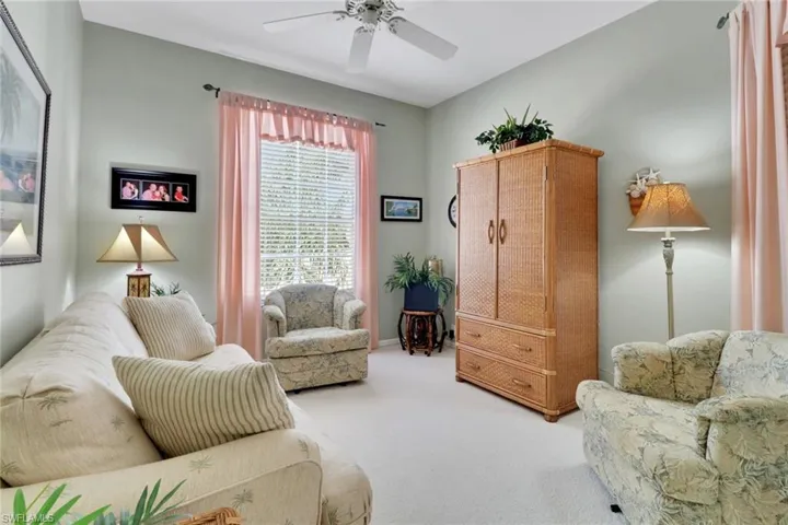 Sitting room with carpet floors and ceiling fan