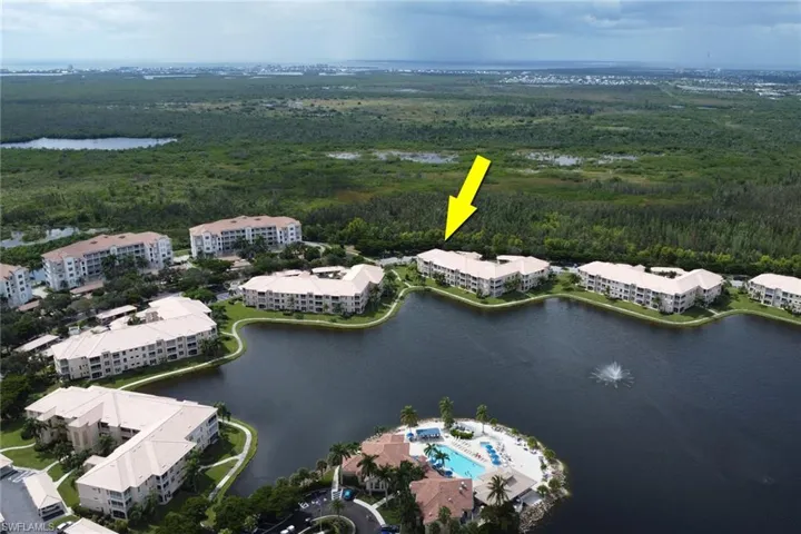 Bird's eye view of a large body of water and apartment complex / building