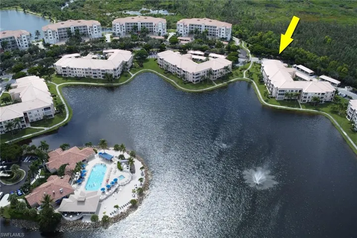 Aerial view of a nearby body of water and a pool area