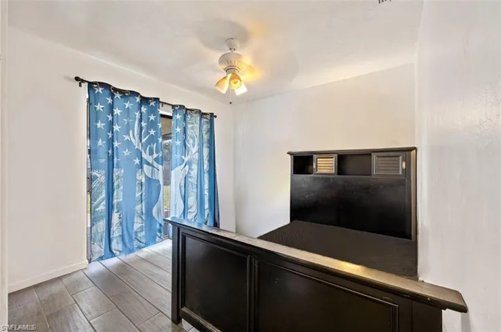 Unfurnished bedroom featuring ceiling fan