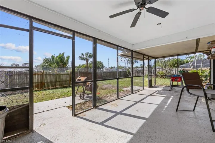 Sunroom featuring ceiling fan