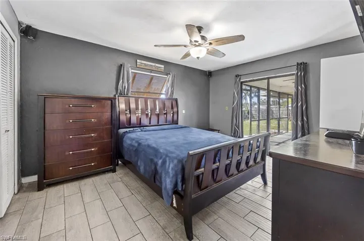 Bedroom featuring access to outside, a closet, and ceiling fan