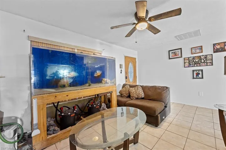 Tiled living room with ceiling fan