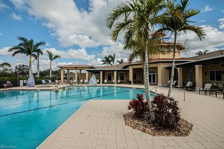 Community pool with a patio