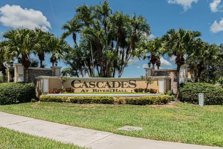 Community / neighborhood sign with a yard